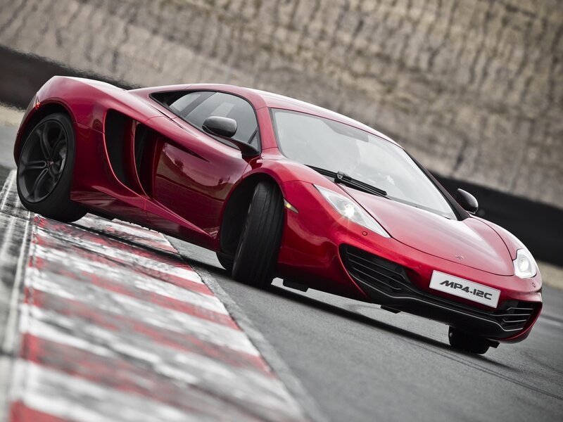 Red McLaren MP4-12C on track