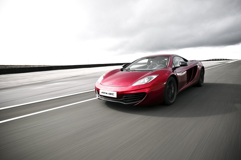 Red McLaren MP4-12C on track