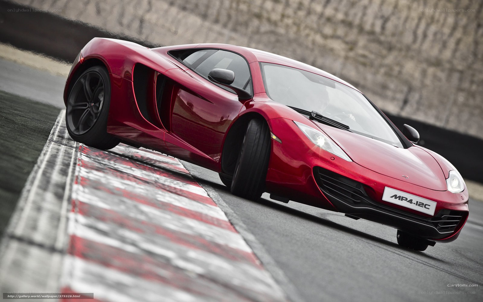 Red McLaren MP4-12C on track