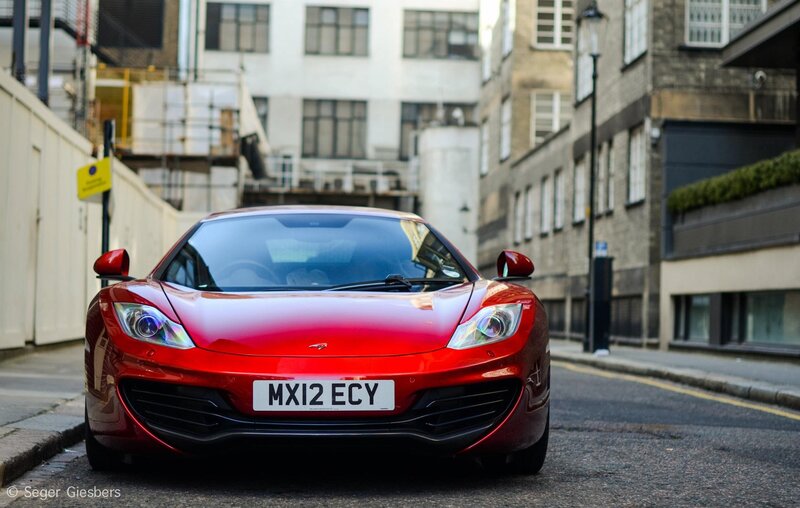 Red McLaren on a city street
