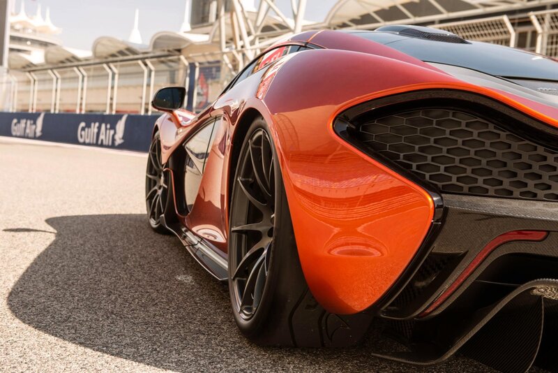 Red McLaren on a racetrack