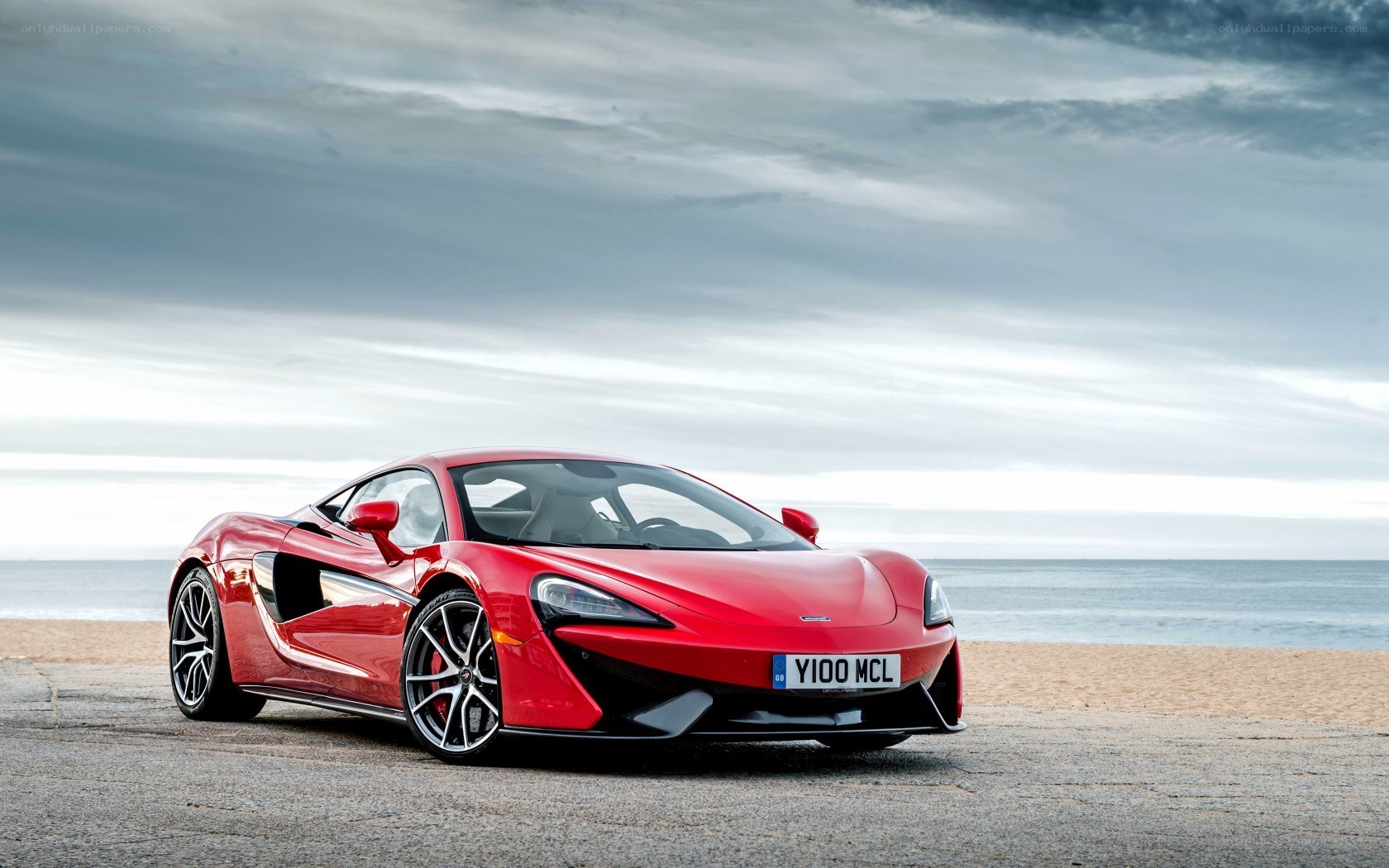 Red McLaren on beach