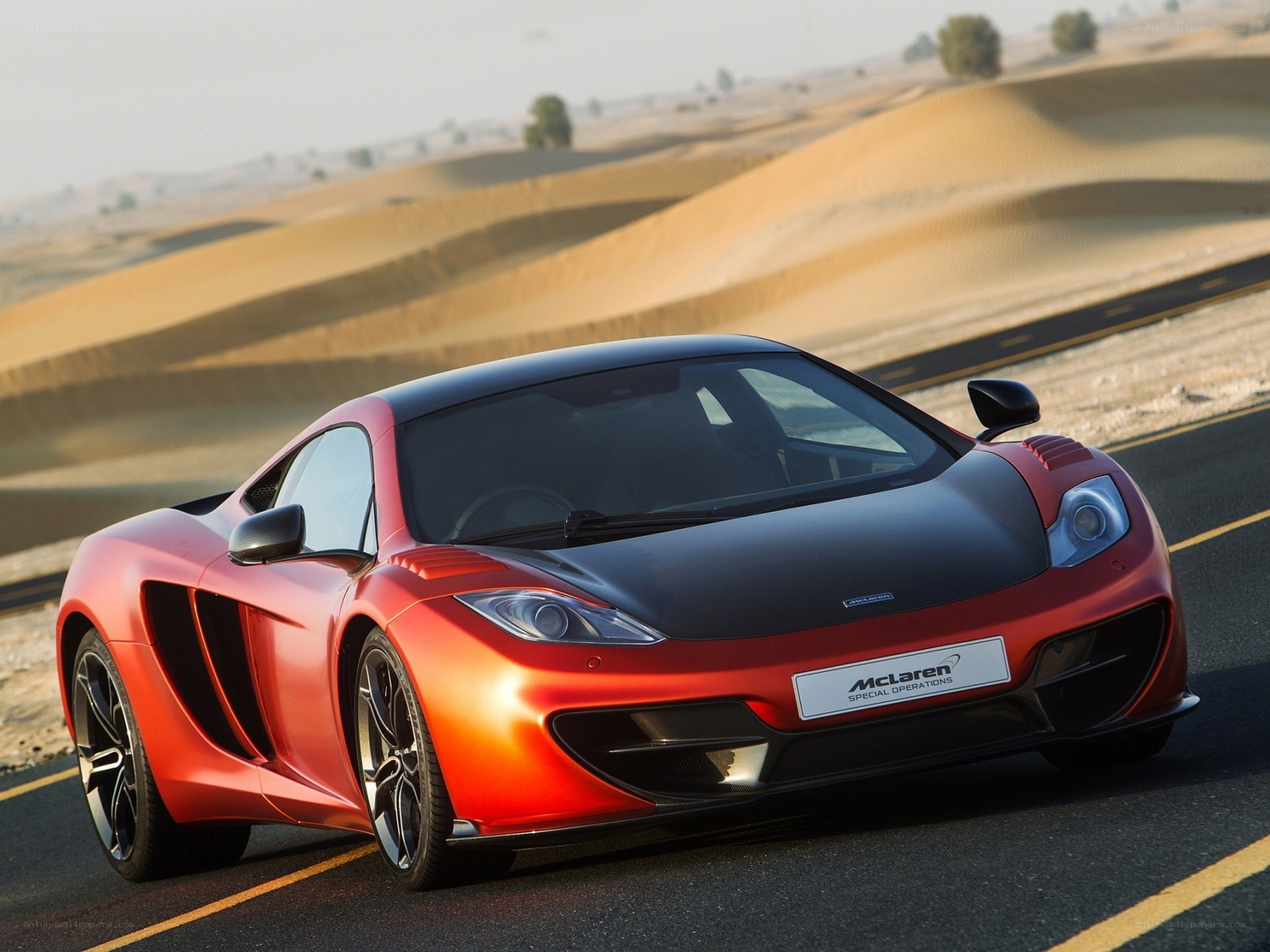Red McLaren on desert road