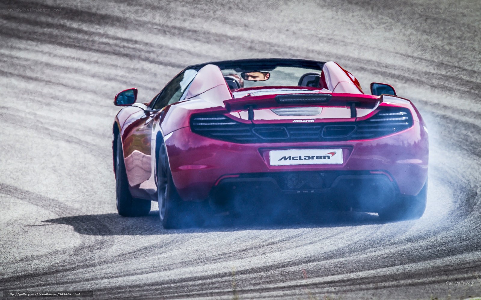 Red McLaren on racetrack