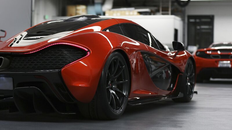 Red McLaren P1 in a garage