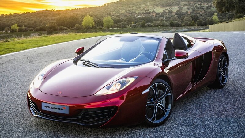 Red McLaren sports car on track