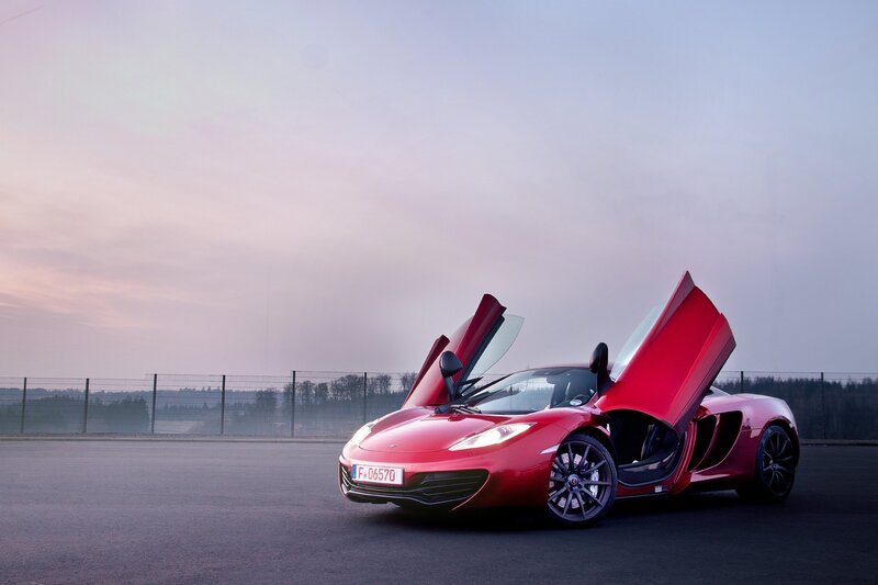 Red McLaren with doors open
