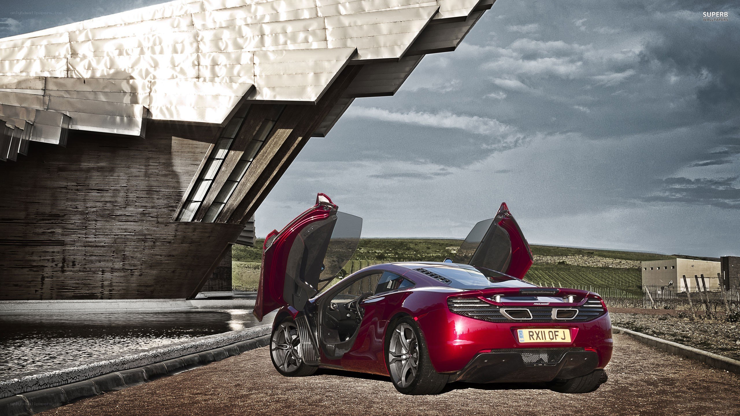 Red McLaren with doors open
