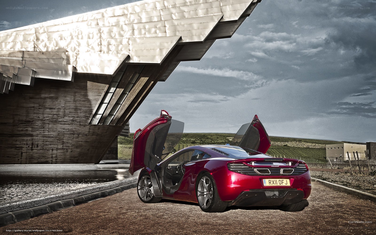 Red McLaren with doors open