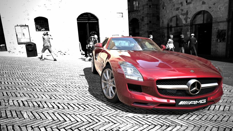 Red Mercedes-AMG on cobblestones