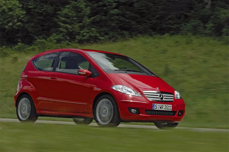 red mercedes-benz a-class in motion
