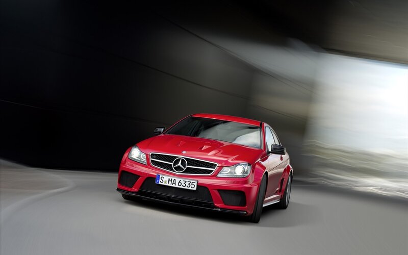 Red Mercedes-Benz C63 AMG in motion