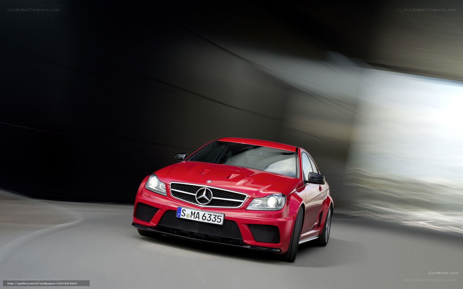 Red Mercedes-Benz C63 AMG in motion