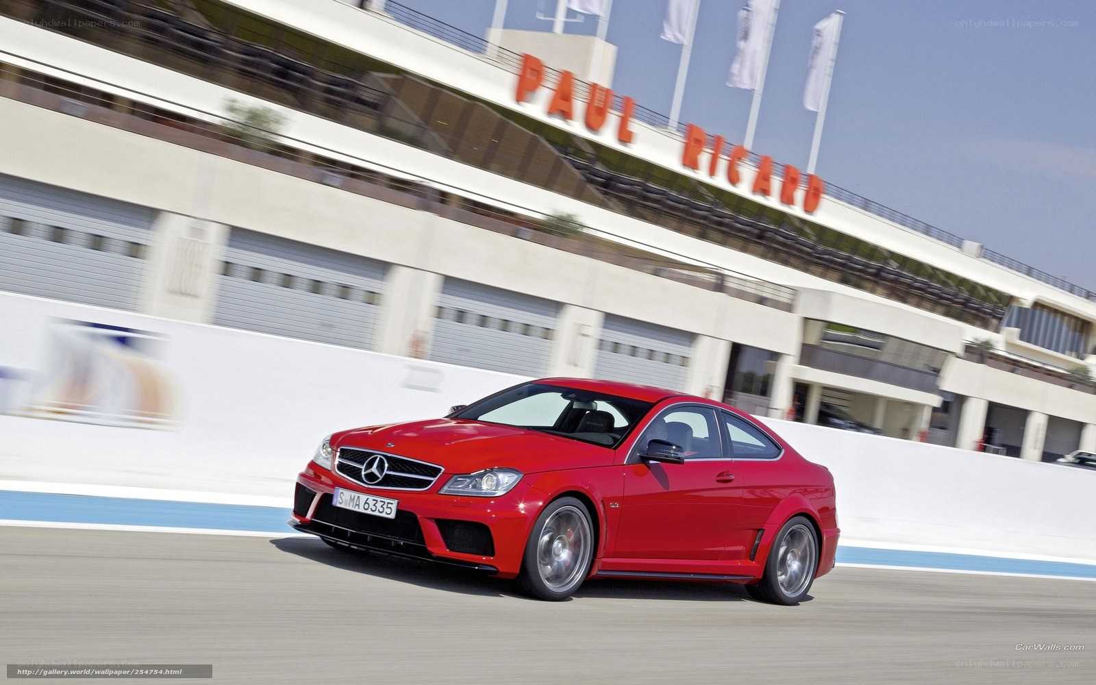 Red Mercedes-Benz C63 AMG on racetrack
