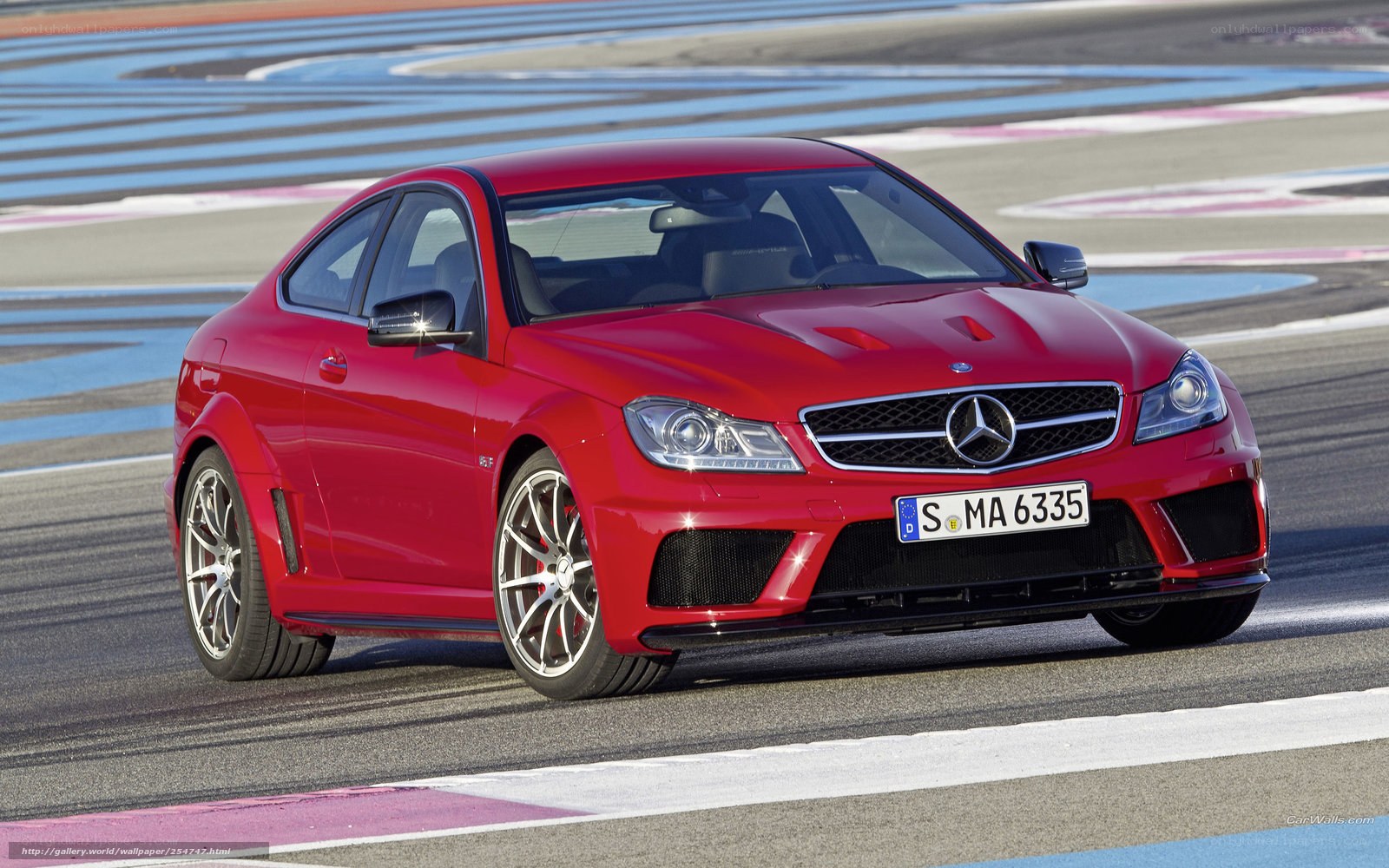 Red Mercedes-Benz C63 AMG on racetrack