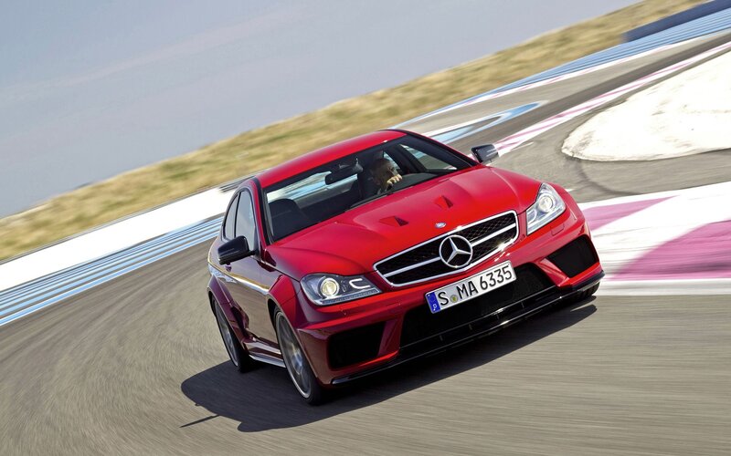 Red Mercedes-Benz C63 AMG on track