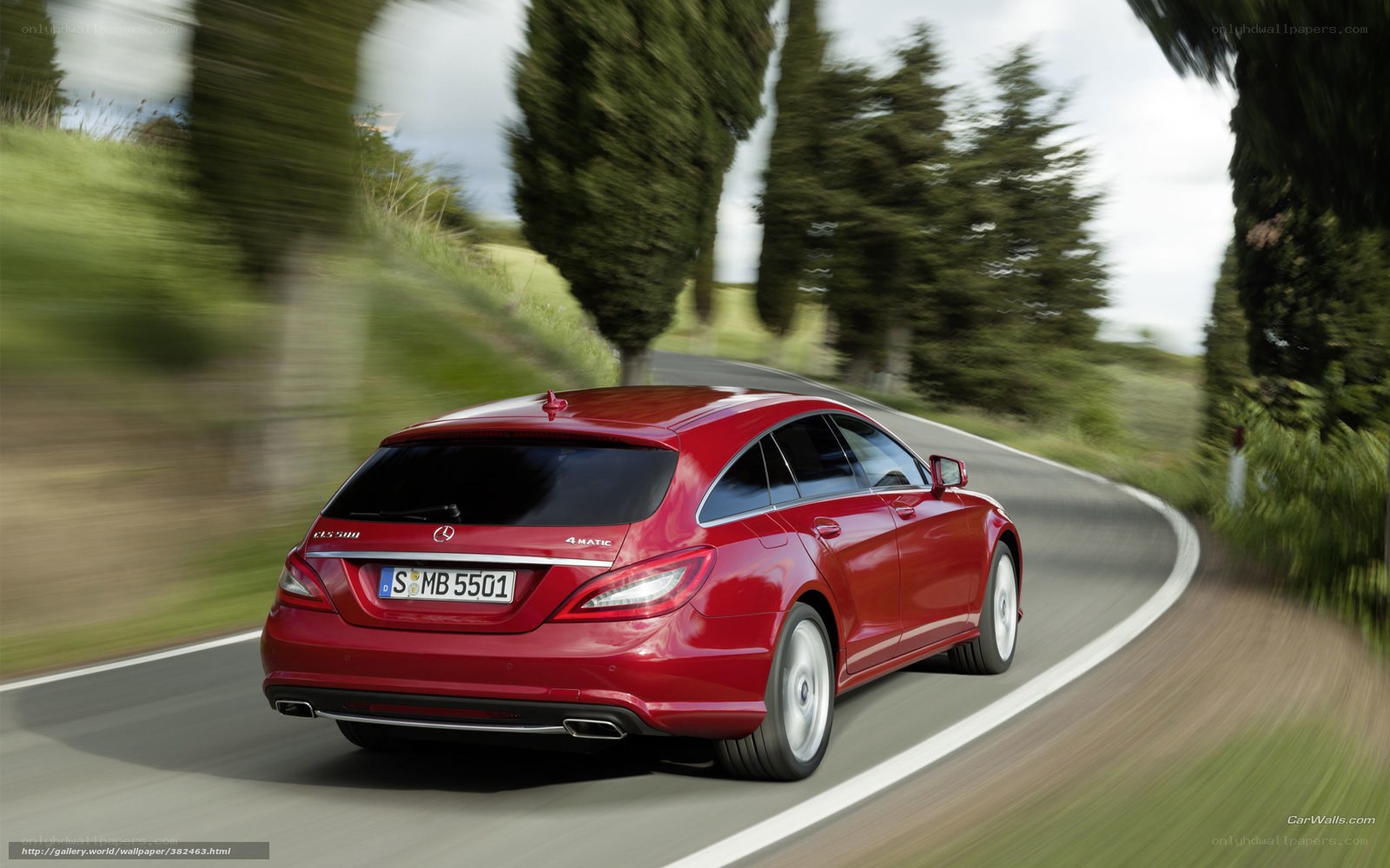 Red Mercedes-Benz CLS driving on road