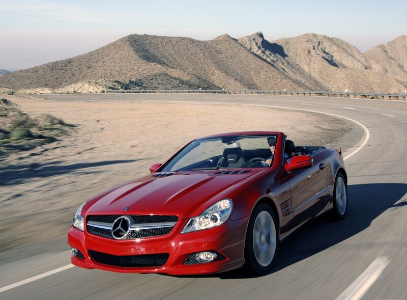 Red Mercedes-Benz convertible on road