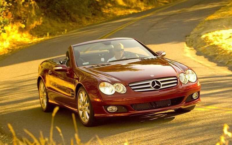 Red Mercedes-Benz convertible on road