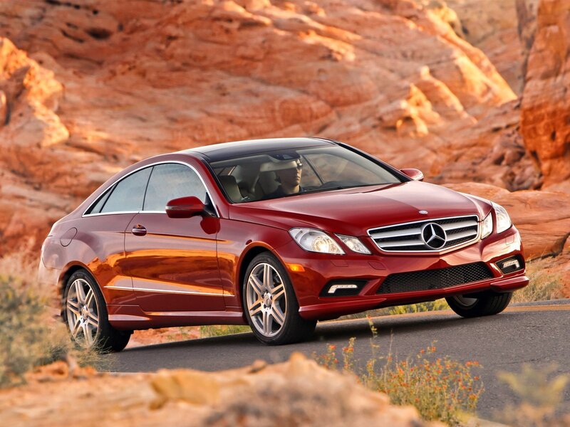 Red Mercedes-Benz coupe on desert road