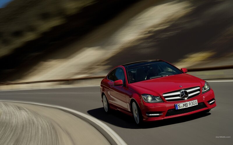 red mercedes-benz on winding road