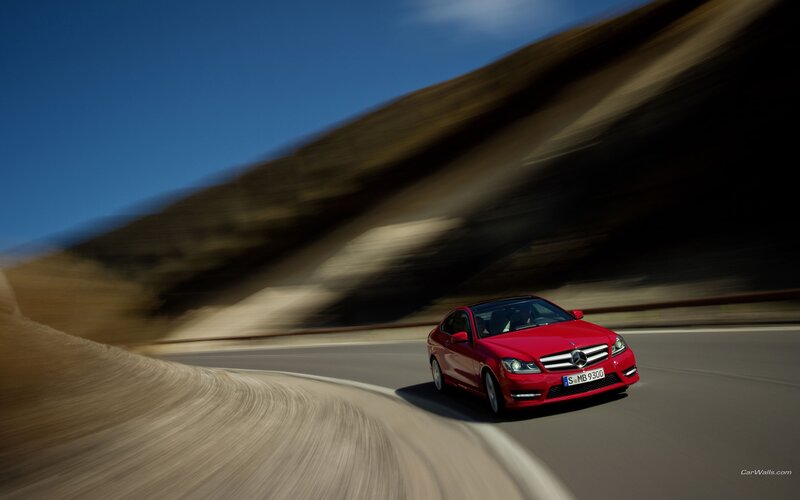 Red Mercedes-Benz on winding road