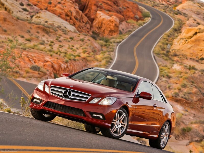 Red Mercedes-Benz on winding road