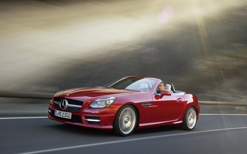 Red Mercedes-Benz SLK driving