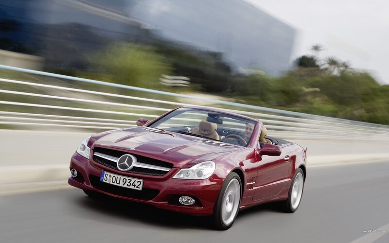 Red Mercedes-Benz SLK driving