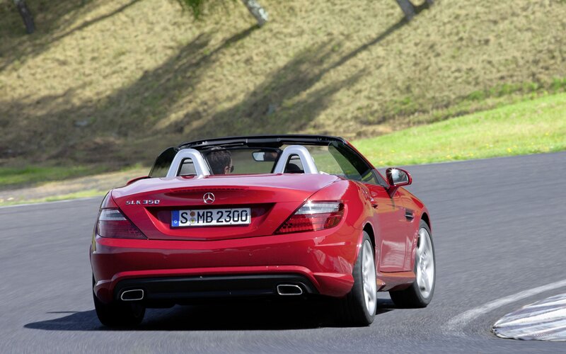 red mercedes-benz slk driving