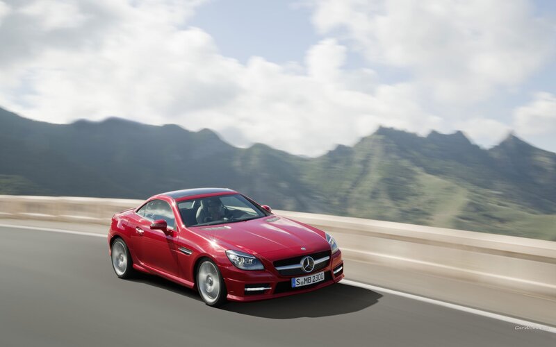 Red Mercedes-Benz SLK driving on road