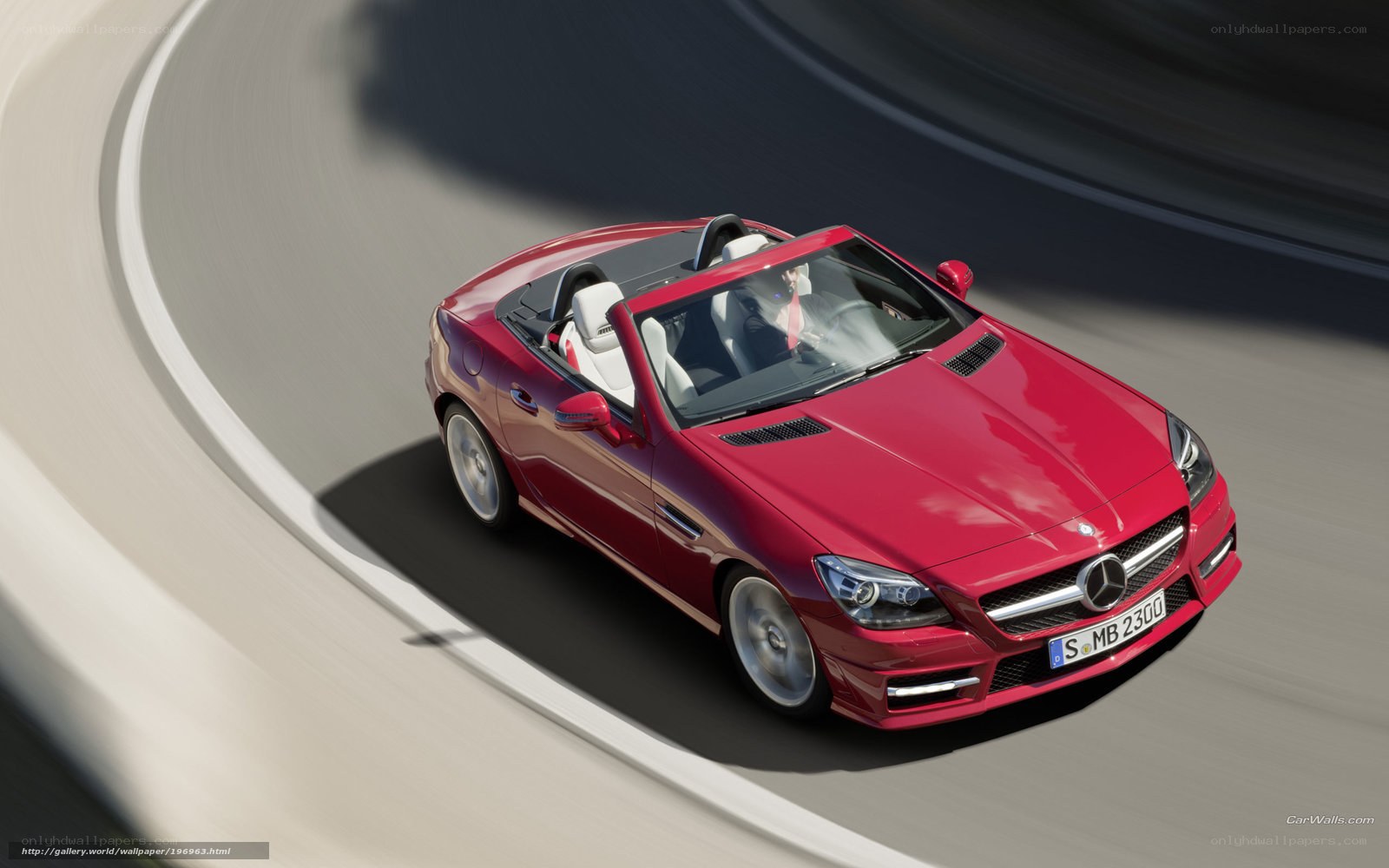 Red Mercedes-Benz SLK driving on track