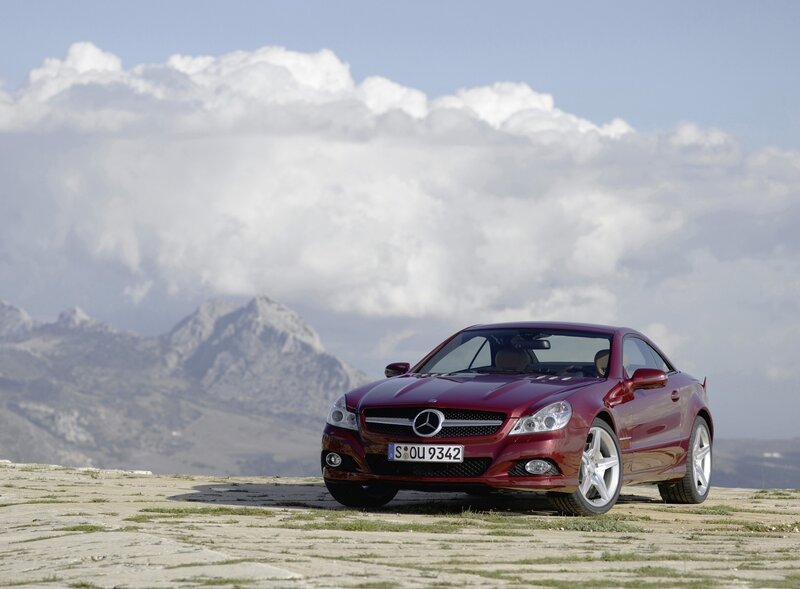 Red Mercedes-Benz SLK parked on a hill