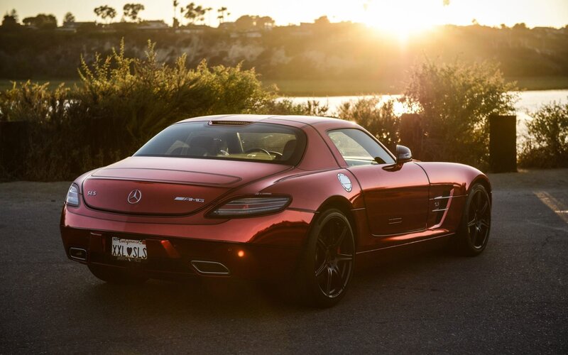 Red Mercedes-Benz SLS AMG at sunset
