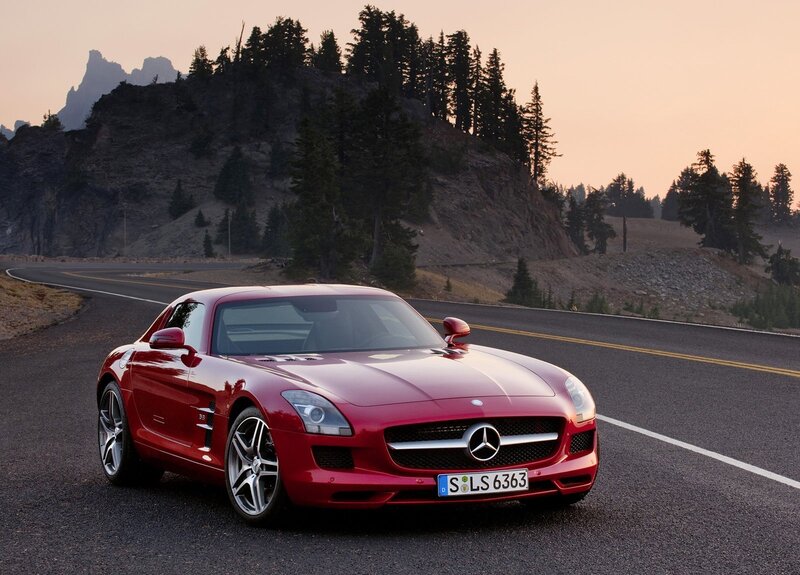 Red Mercedes-Benz SLS AMG on a mountain road