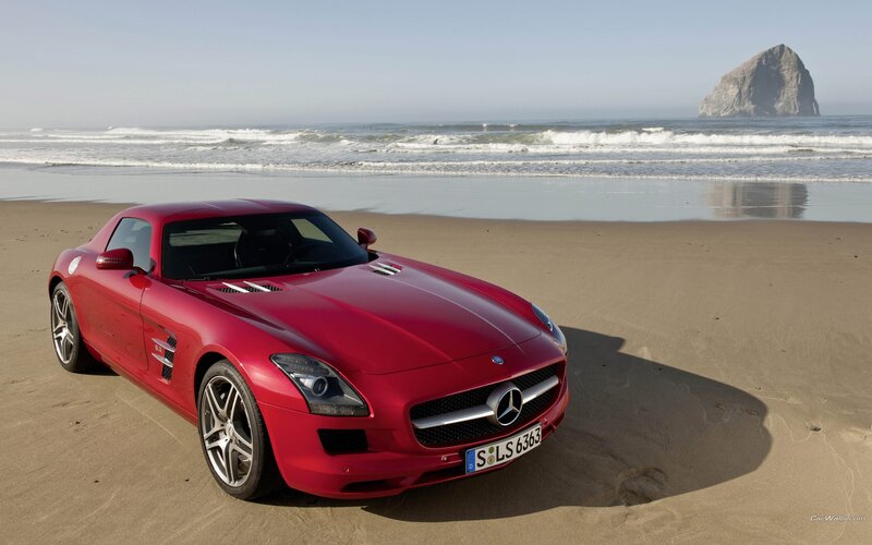 Red Mercedes-Benz SLS AMG on beach