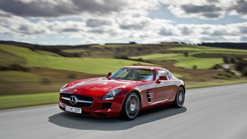 Red Mercedes-Benz SLS AMG on country road