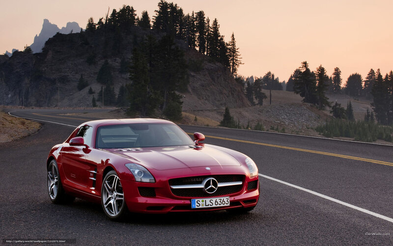 Red Mercedes-Benz SLS AMG on mountain road