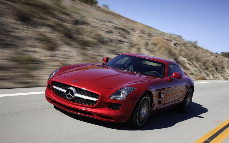 Red Mercedes-Benz SLS AMG on road