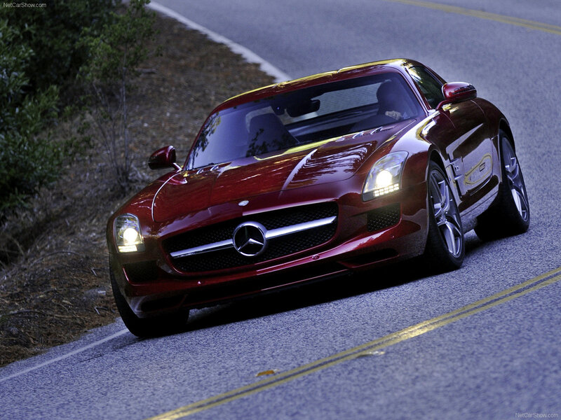 red mercedes-benz sls amg on road