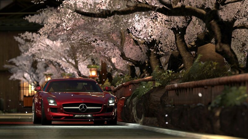Red Mercedes-Benz SLS AMG under cherry blossoms