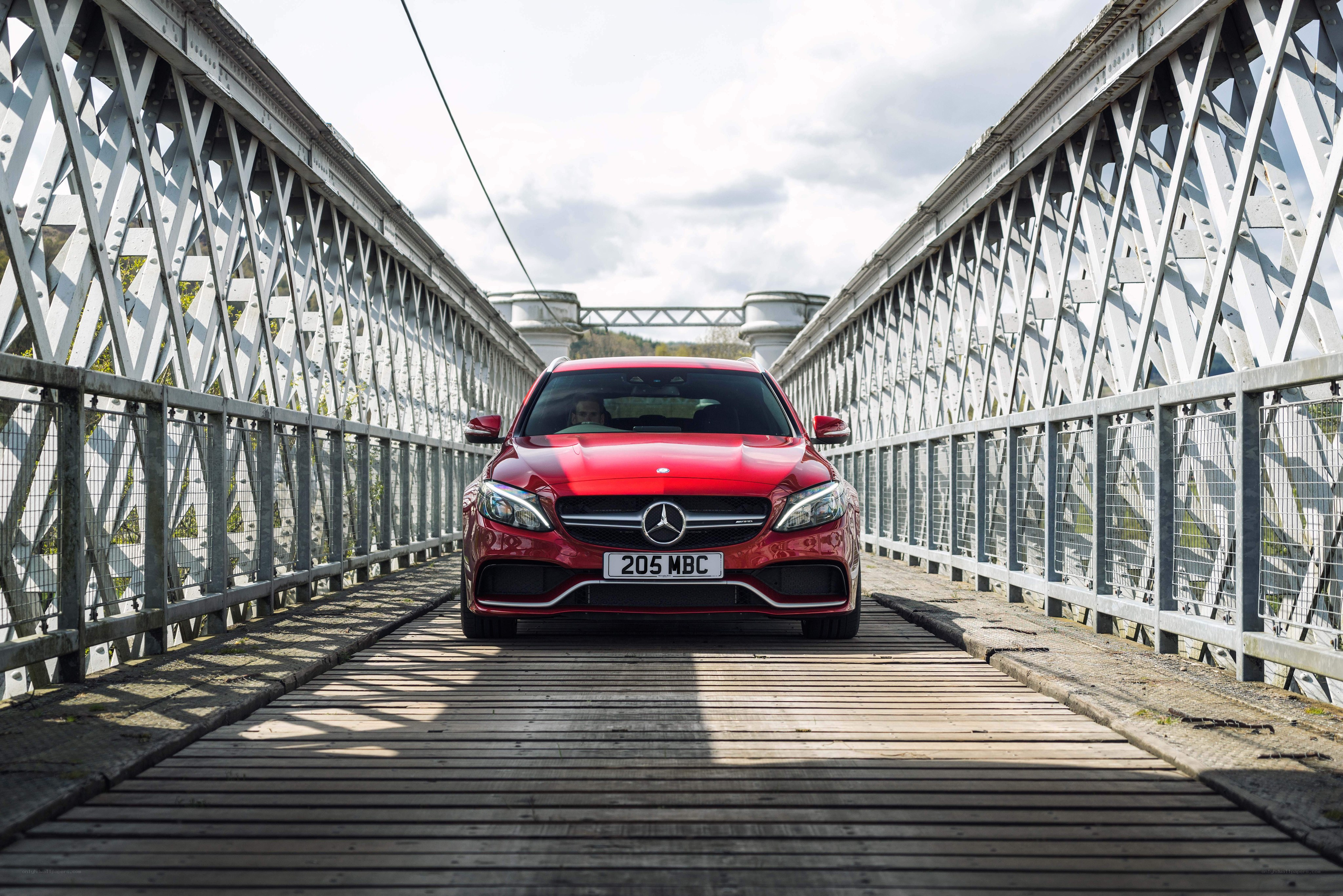 Red Mercedes on a bridge