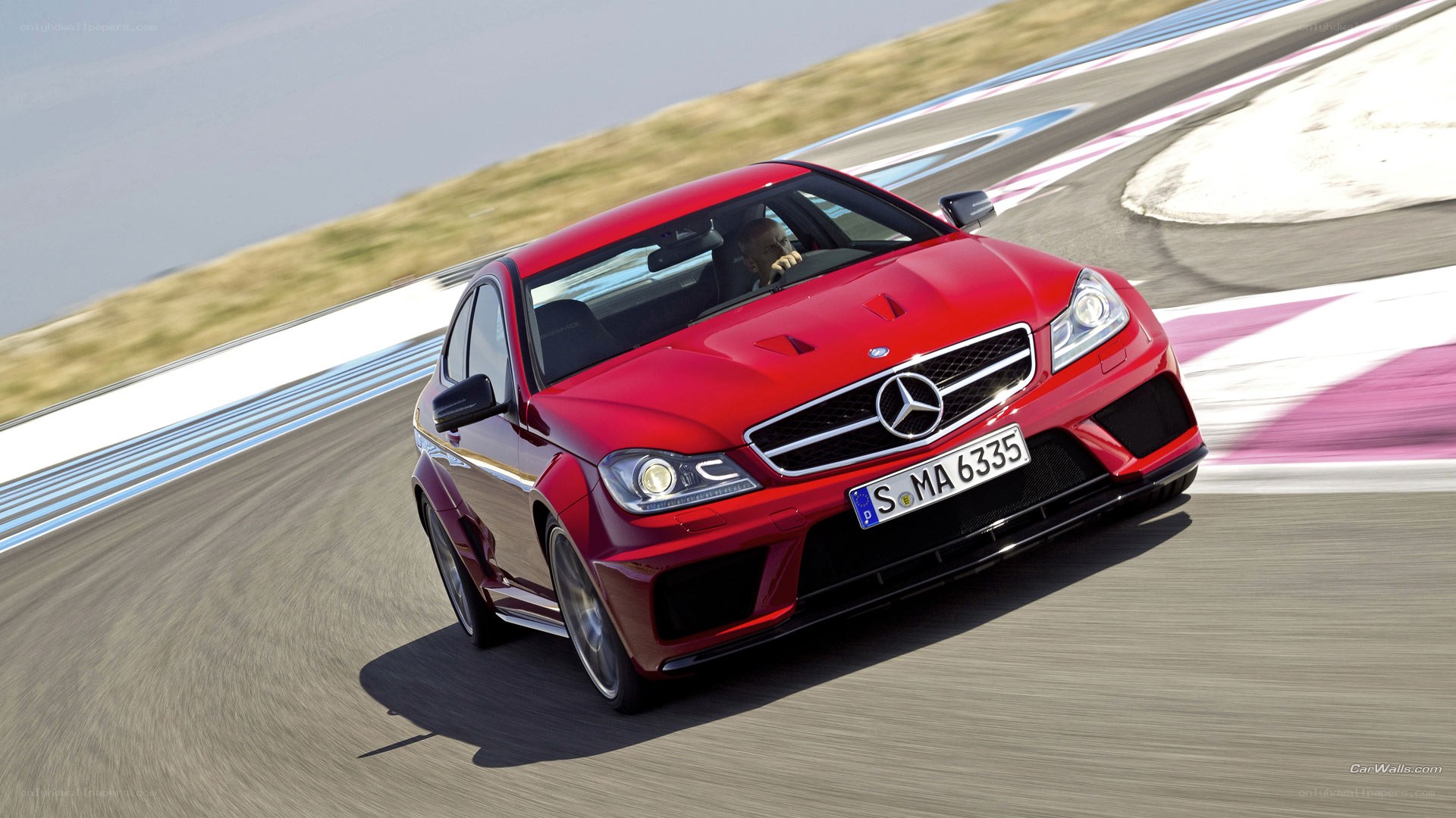 red mercedes on racetrack