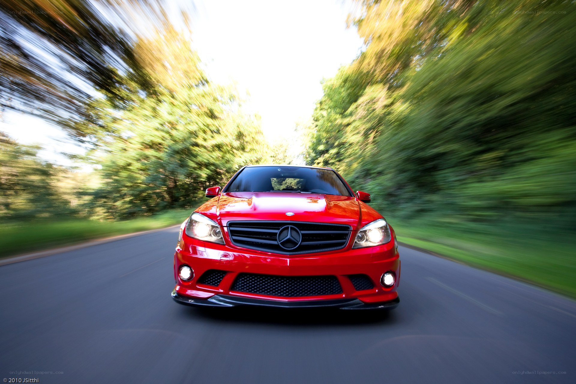Red Mercedes speeding on road