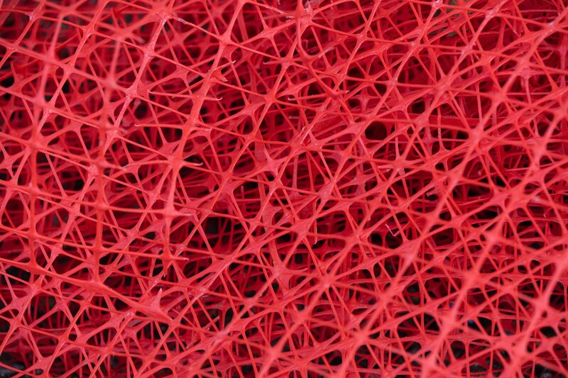 Red mesh texture close-up