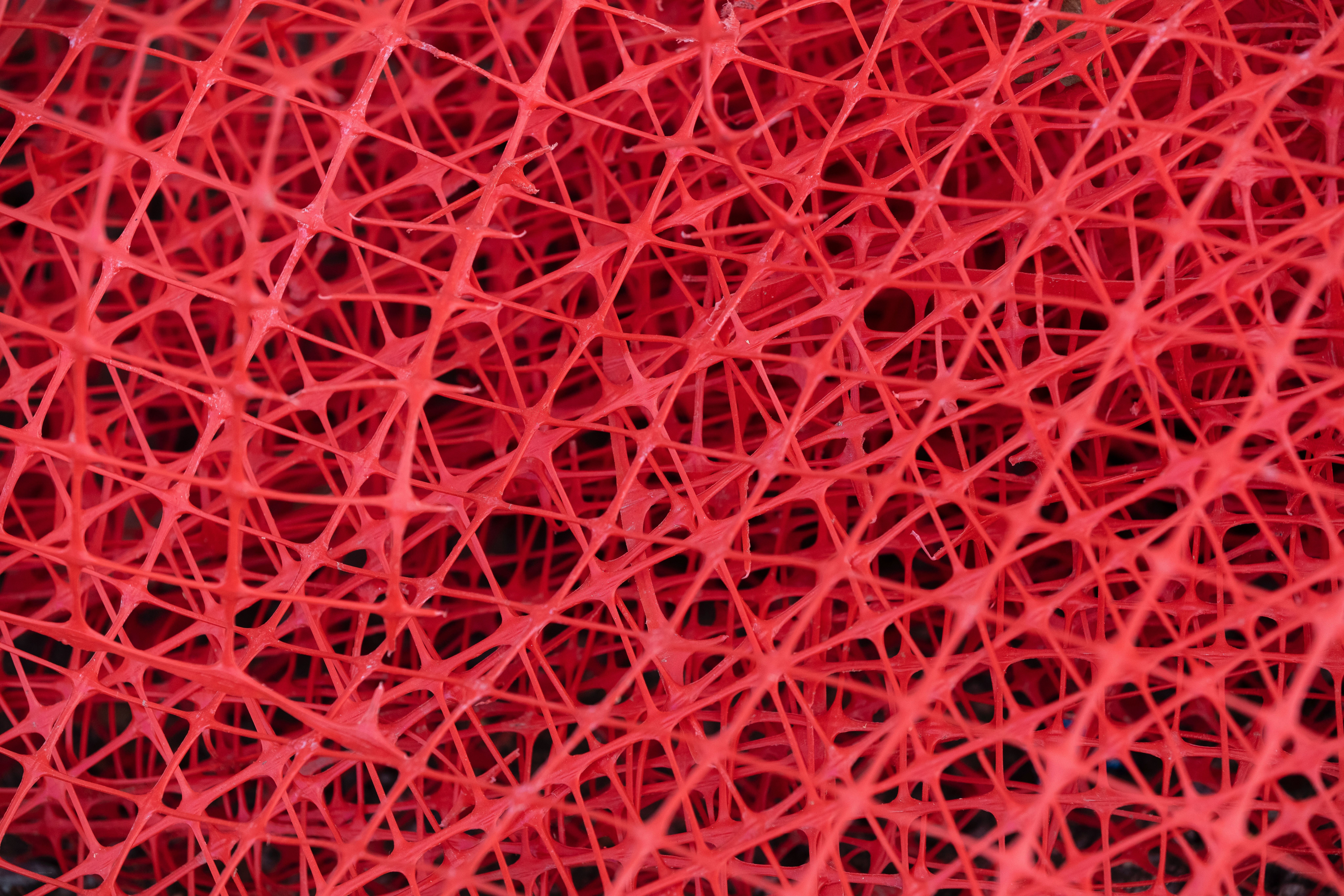 Red mesh texture close-up