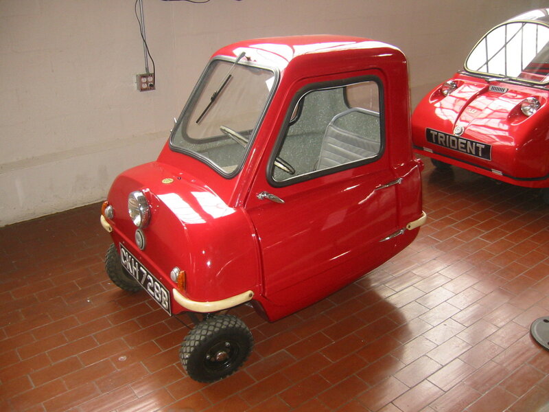 Red microcar in a garage