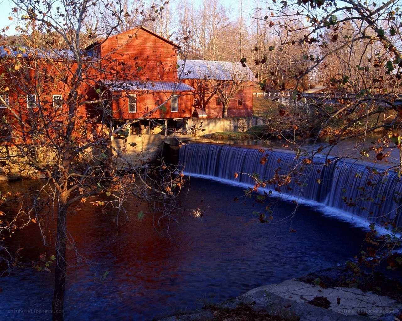 Red Mill by a Waterfall