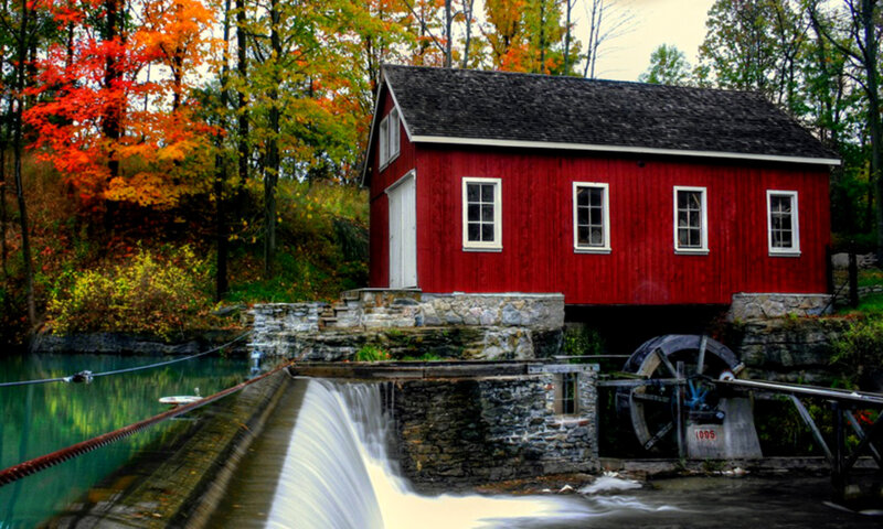 Red mill by autumn river