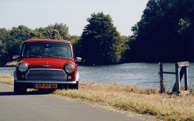 Red Mini Cooper by a river